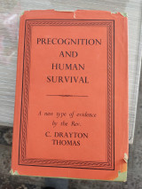 Precognition and human survival